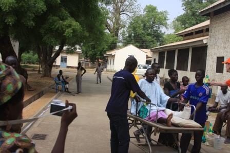 Eye Radio staff helping out a patient wounded by gunshots at the Juba Teaching Hospital.
