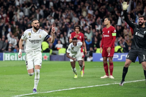 Benzema guides Madrid past Liverpool to reach Champions League quarters